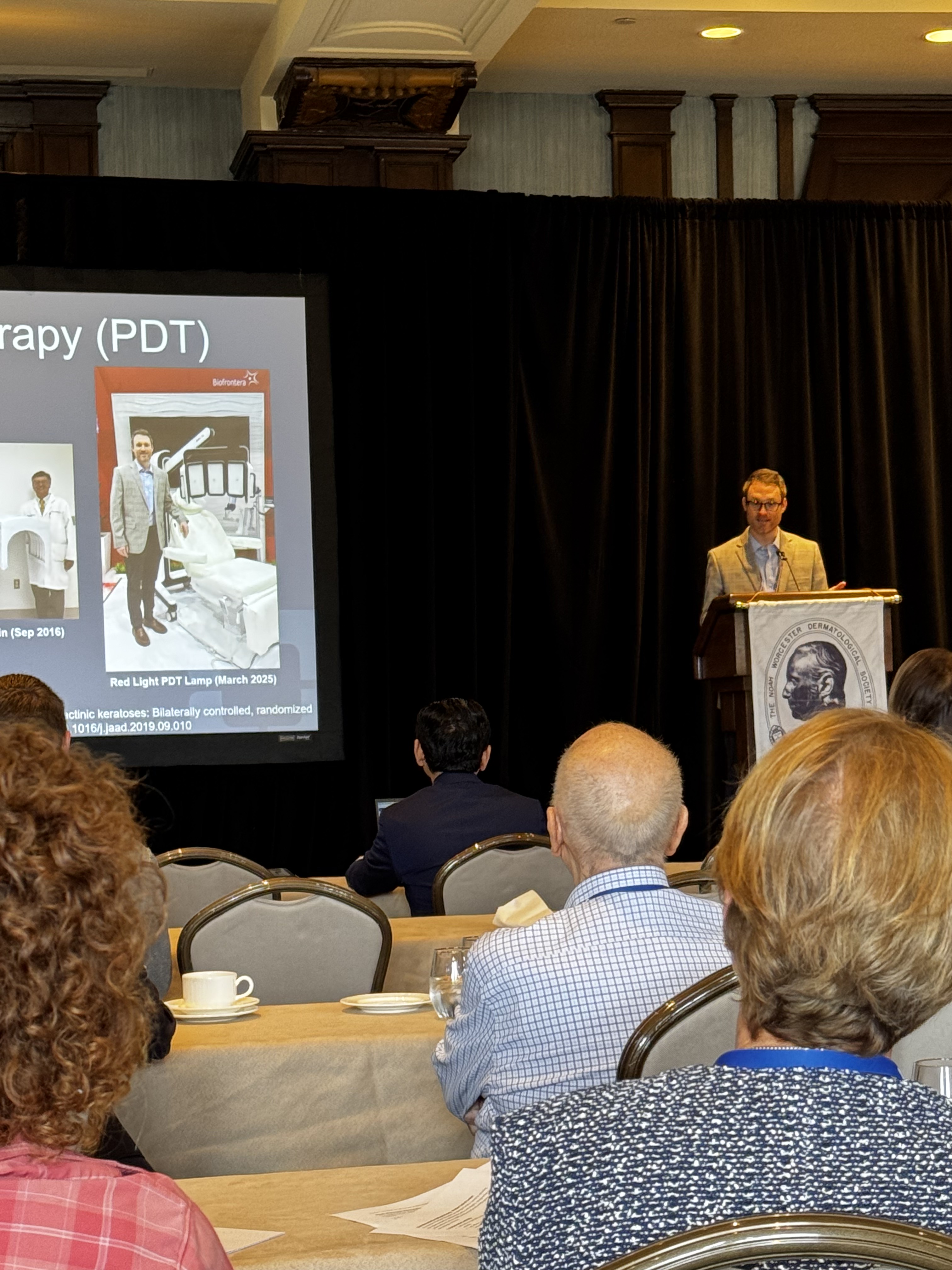 Taylor Bullock, MD presenting dermatology research at the Noah Worcester Dermatological Society Annual Meeting