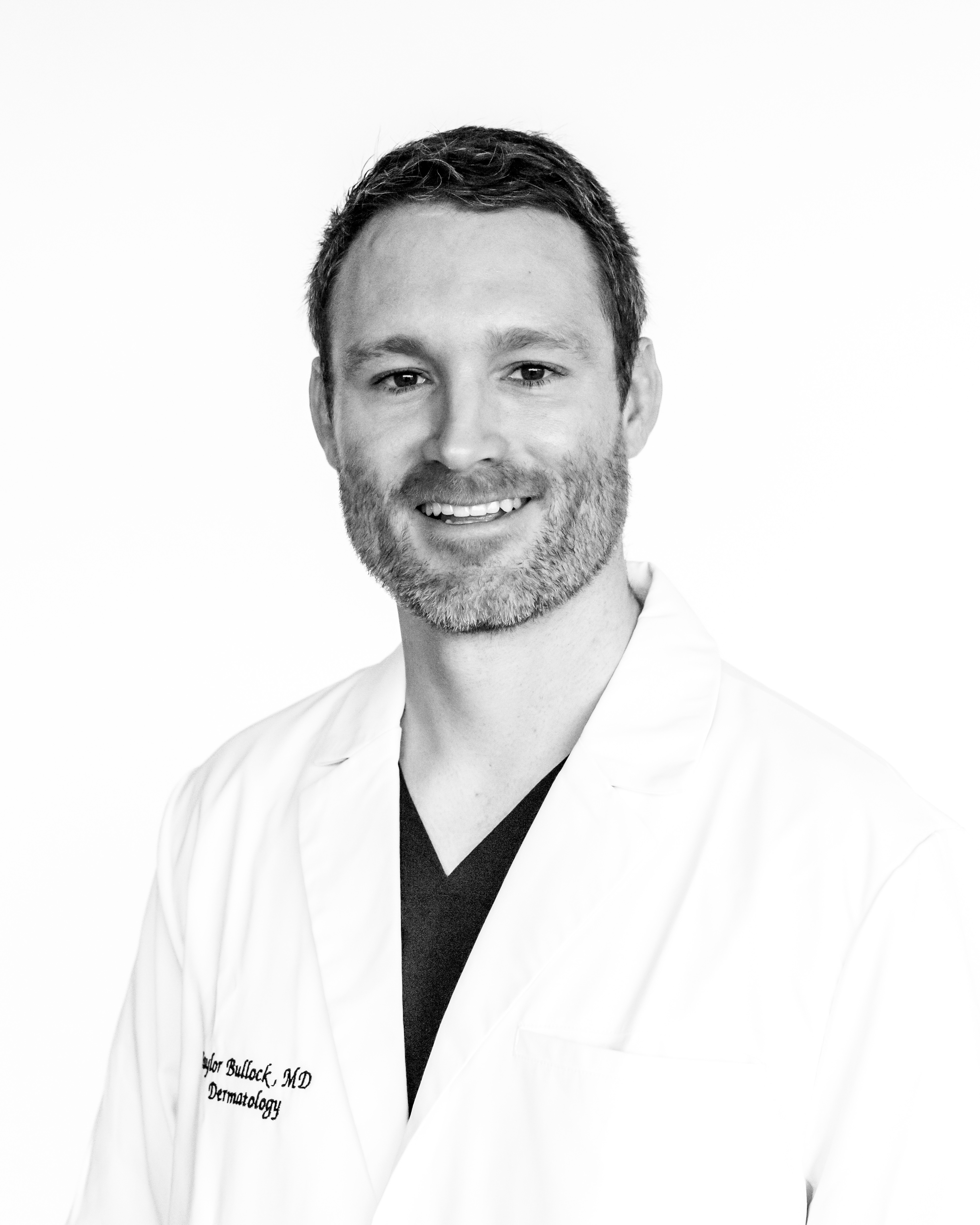 Taylor Bullock, MD in a white coat