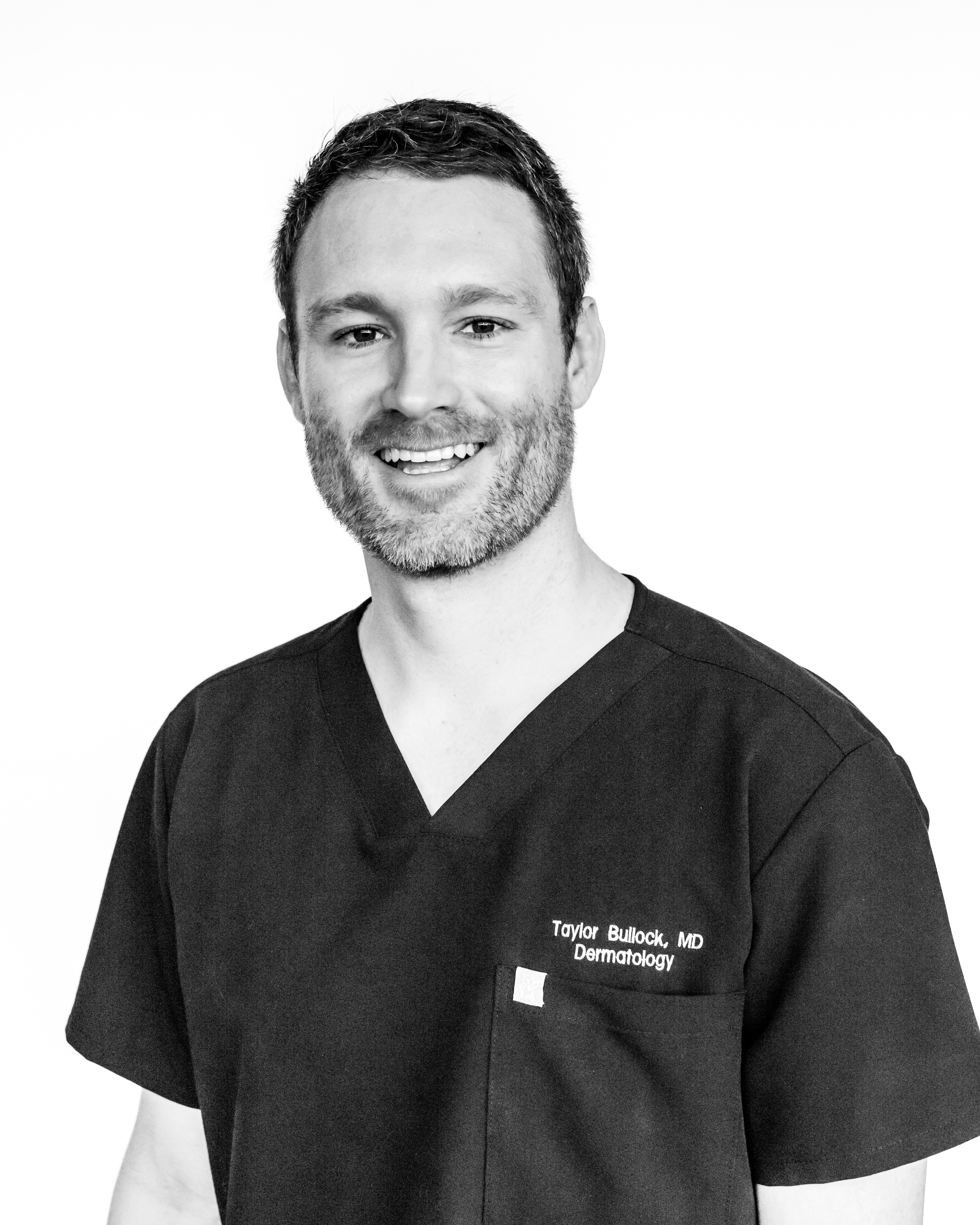 Taylor Bullock, MD in black scrubs
